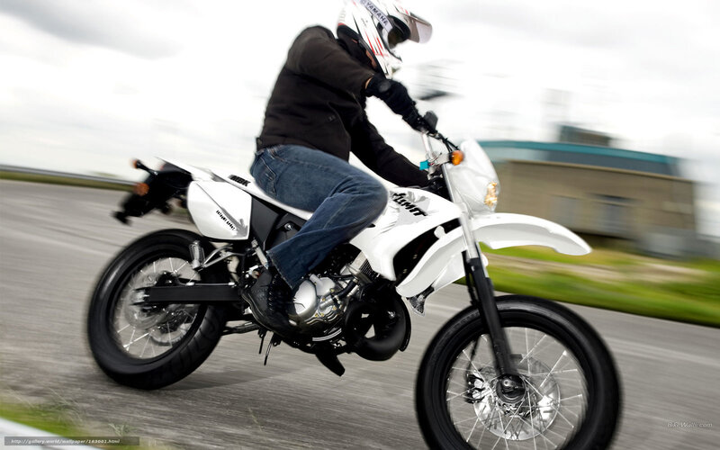 person riding white motorcycle