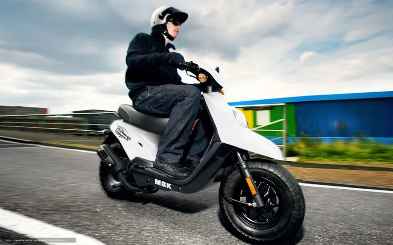 person riding white scooter