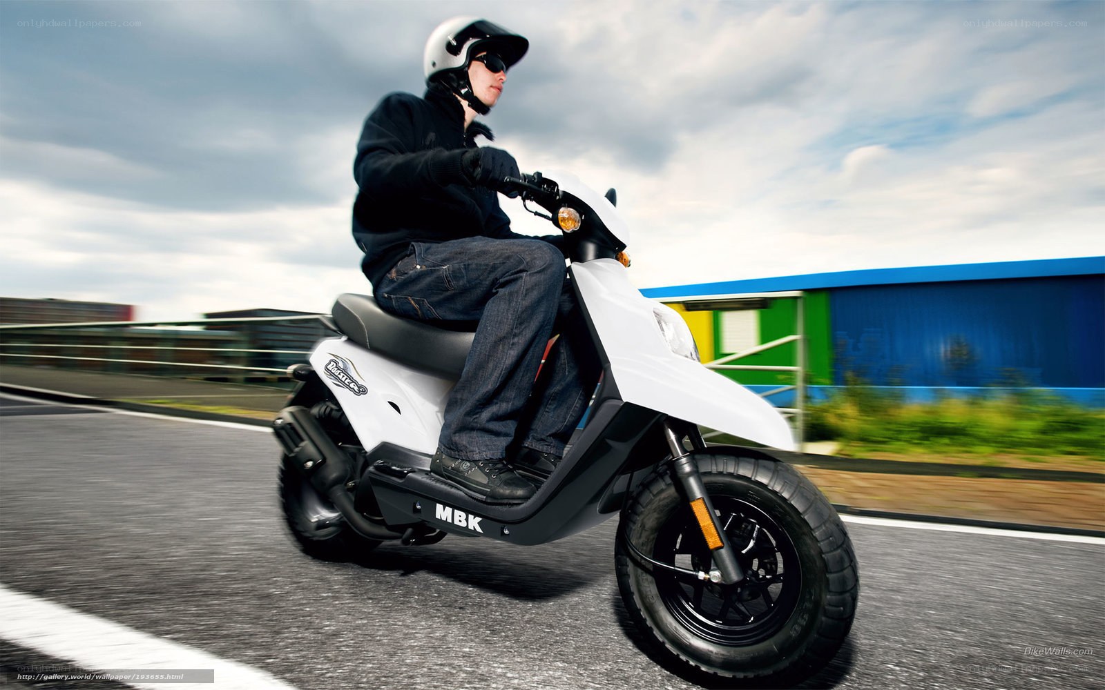 person riding white scooter