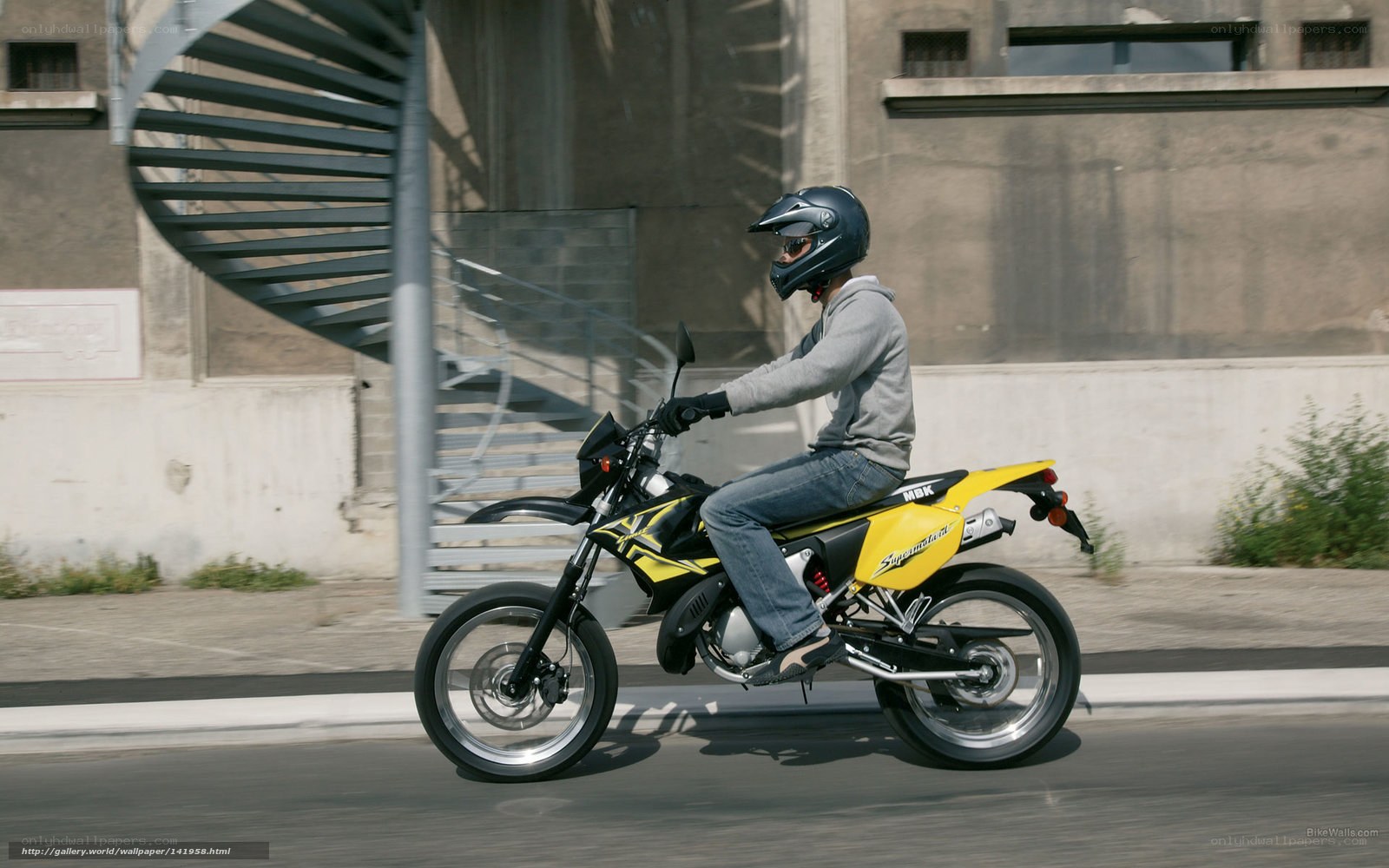 person riding yellow motorcycle