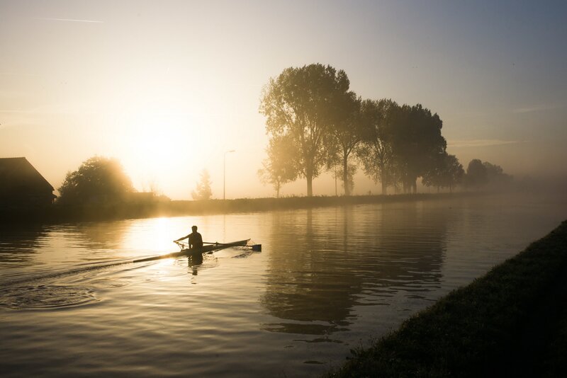 Person Rowing Boat — Gold