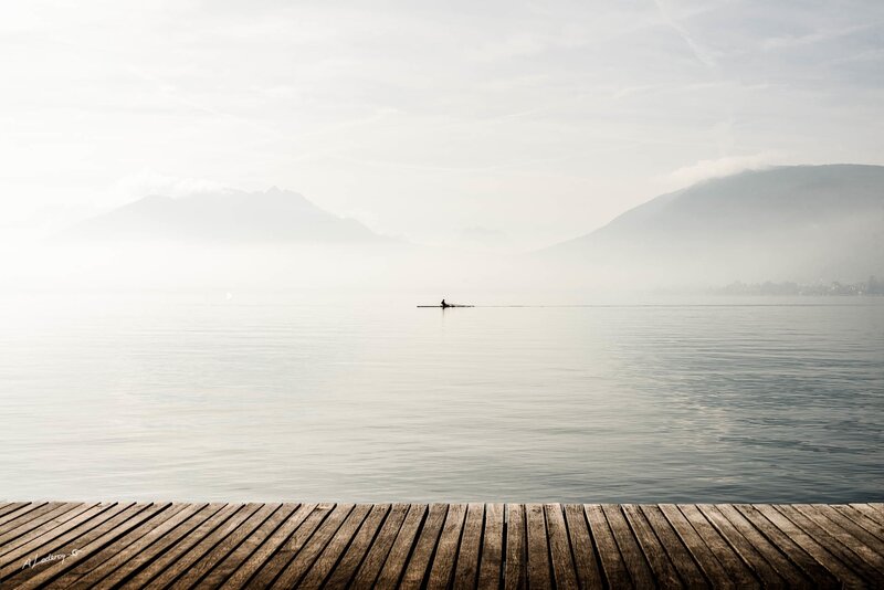 Person Rowing on Lake — Gray