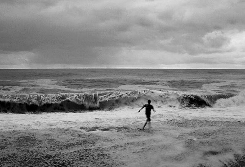 Person running from waves