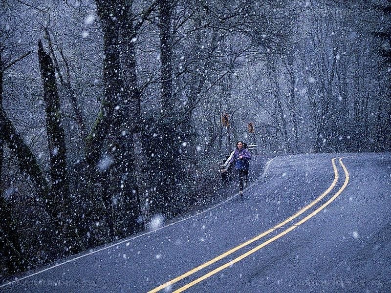 Person running in snowstorm