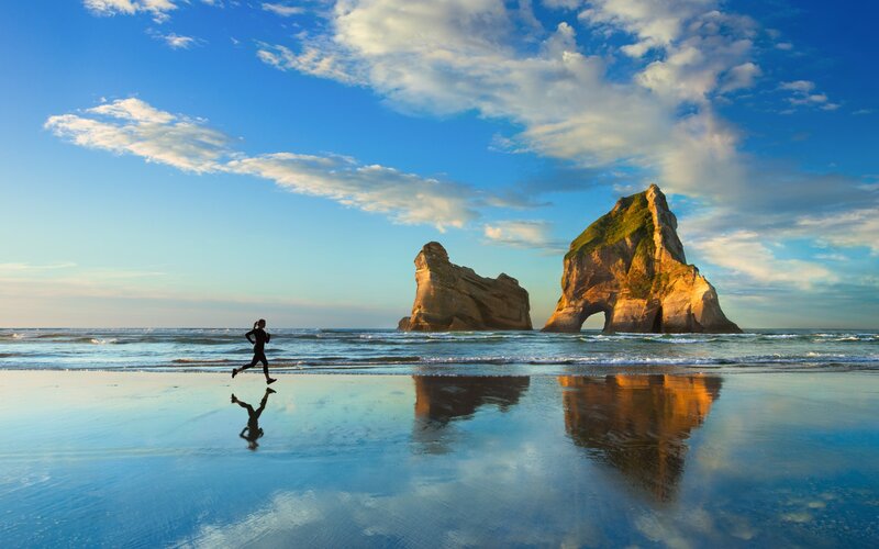 Person Running on Beach — Blue, Serene, Sunset