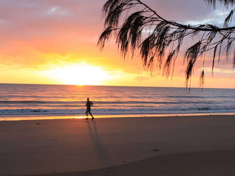 Person Running on Beach — Orange