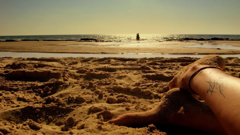 Person's Arm on Beach — Brown, Serene