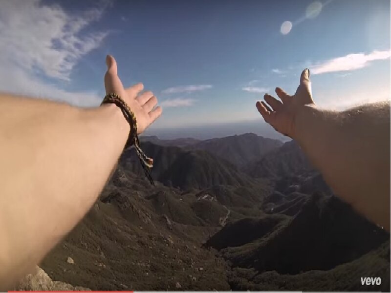 Person's Arms on Mountain