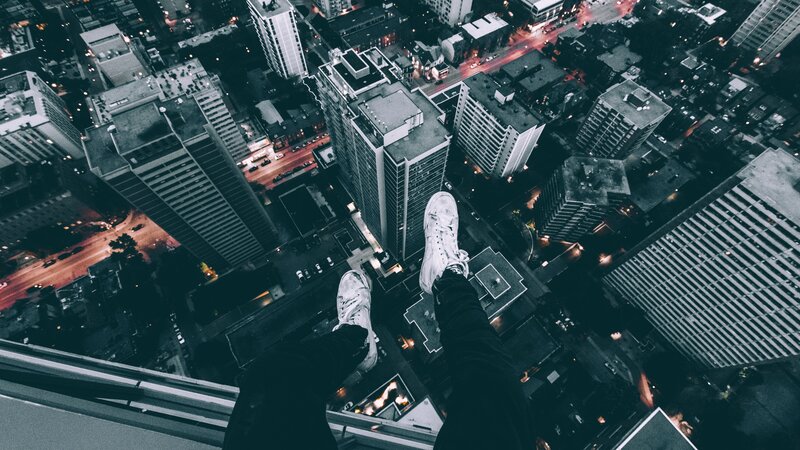 Person's Feet on Edge