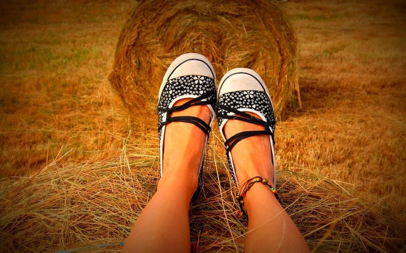 Person's Feet on Hay