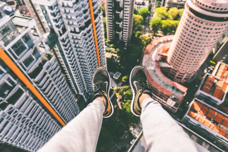 Person's Feet on High Ledge