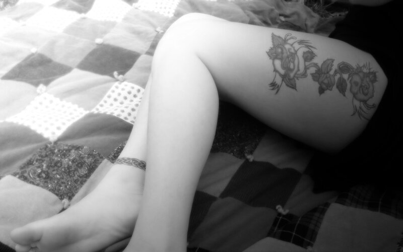 Person's Legs on Quilt