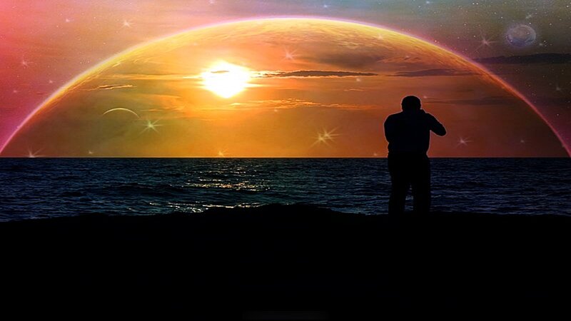 Person silhouetted against alien sunset