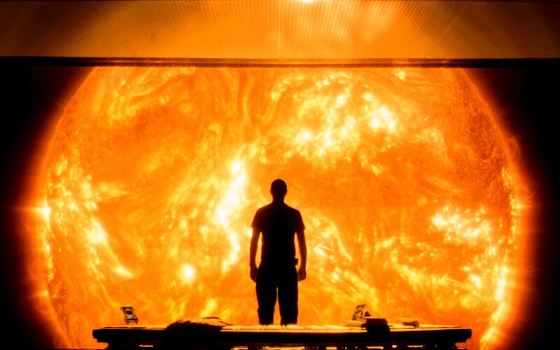 Person silhouetted against the sun