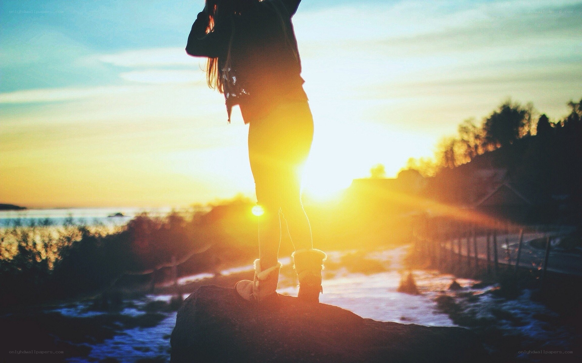 person silhouetted at sunset