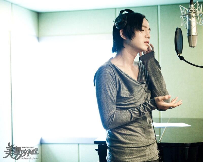 Person Singing in Studio — Gray