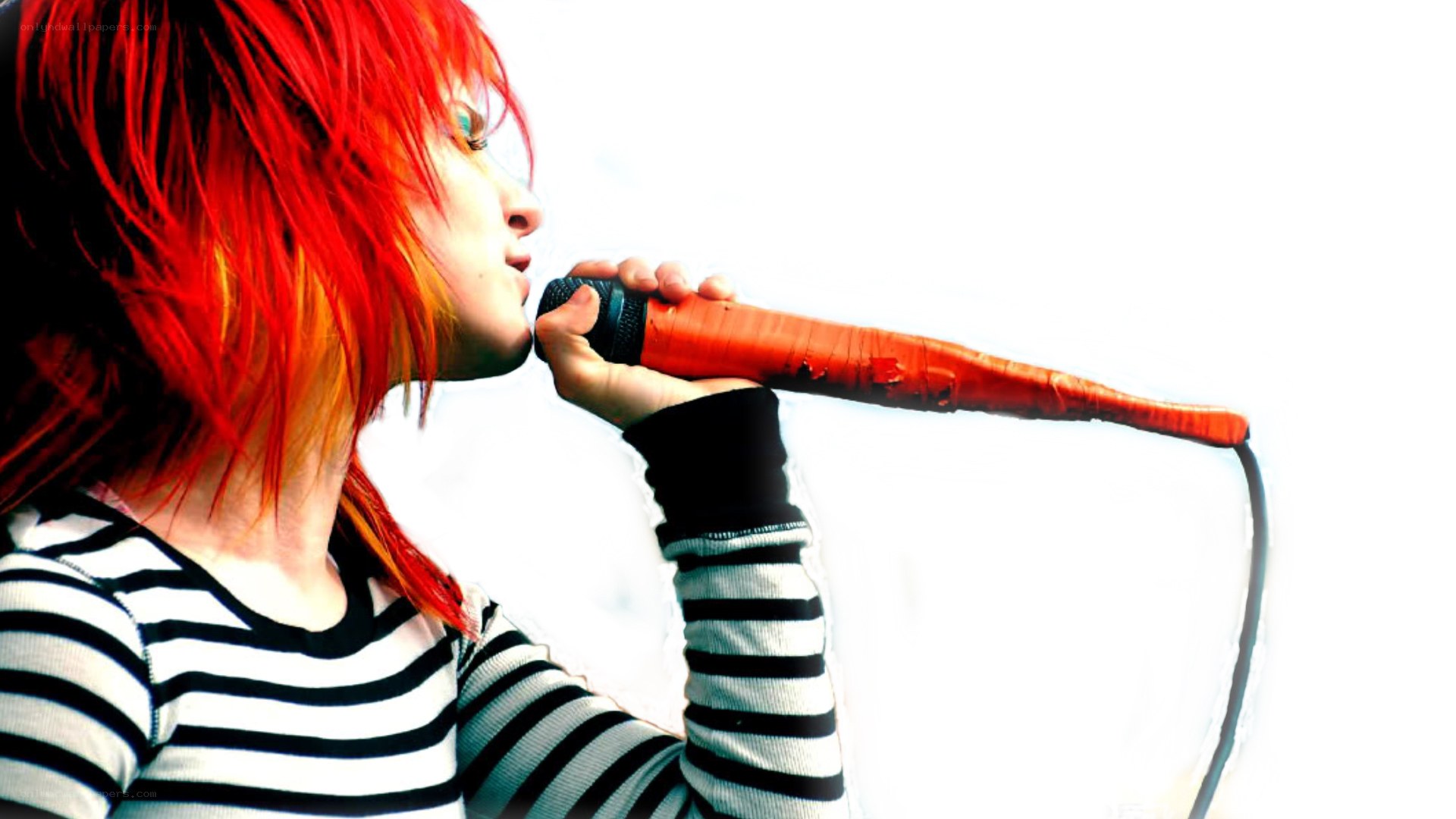 person singing into microphone