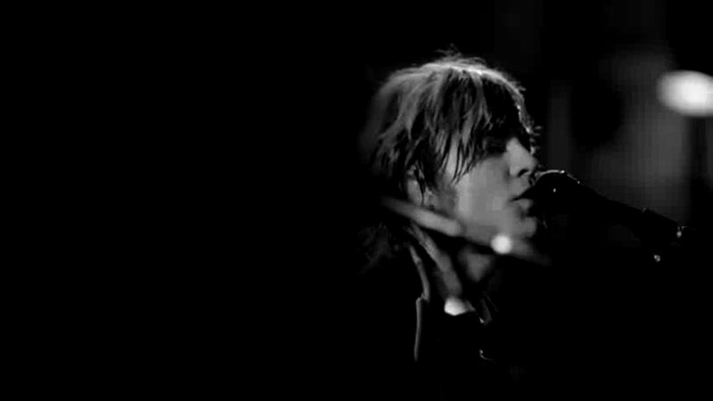 Person Singing into Microphone — Black