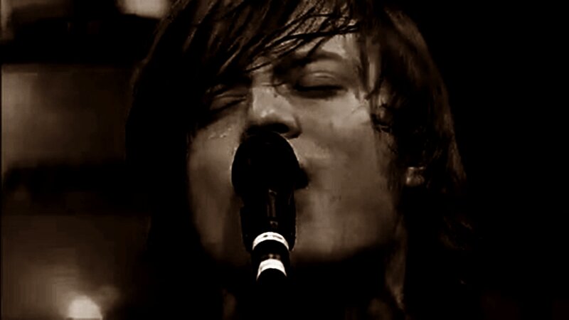 Person Singing into Microphone — Brown