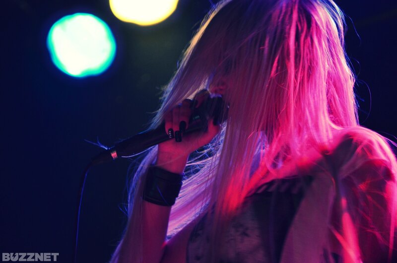 Person Singing into Microphone — Pink