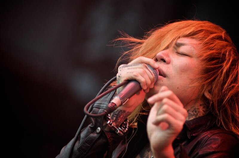 Person Singing into Microphone — Red