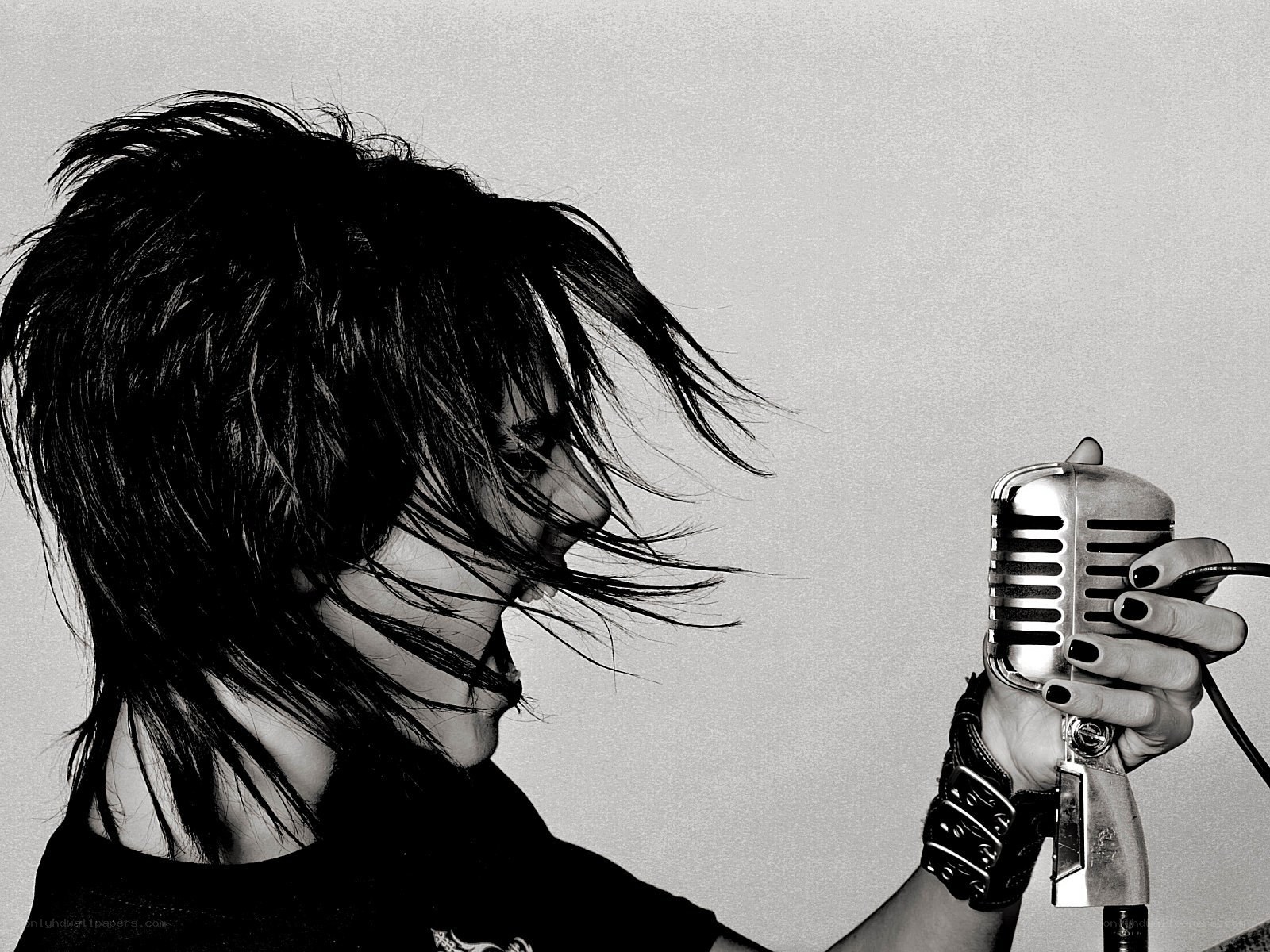 person singing into vintage microphone