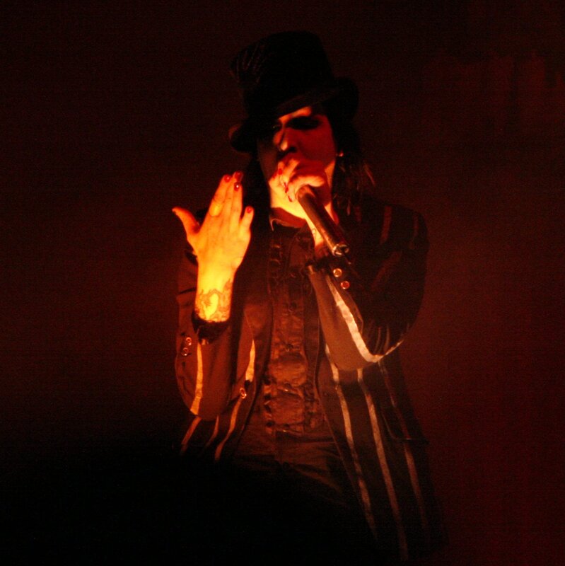 Person Singing on Stage — Black, Dramatic, Night, Photograph