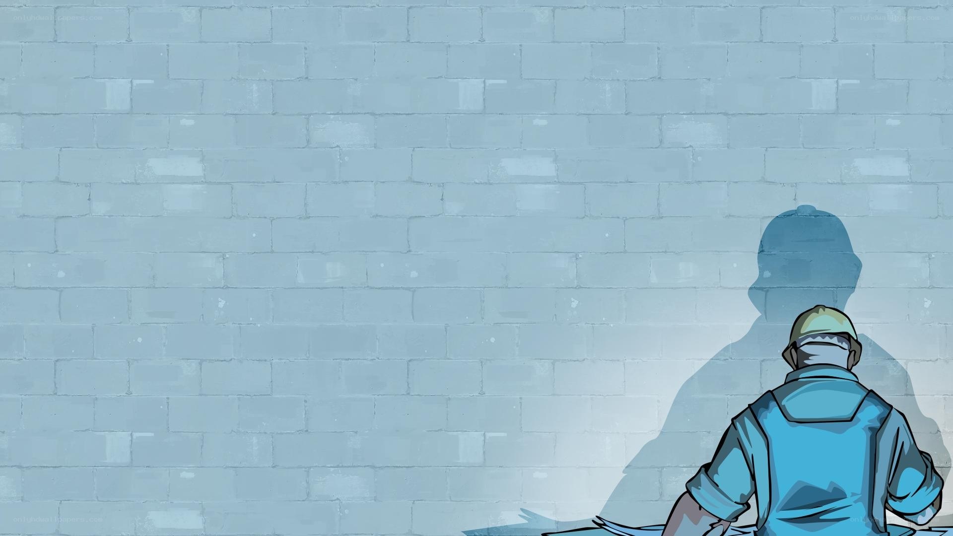 person sitting by a wall