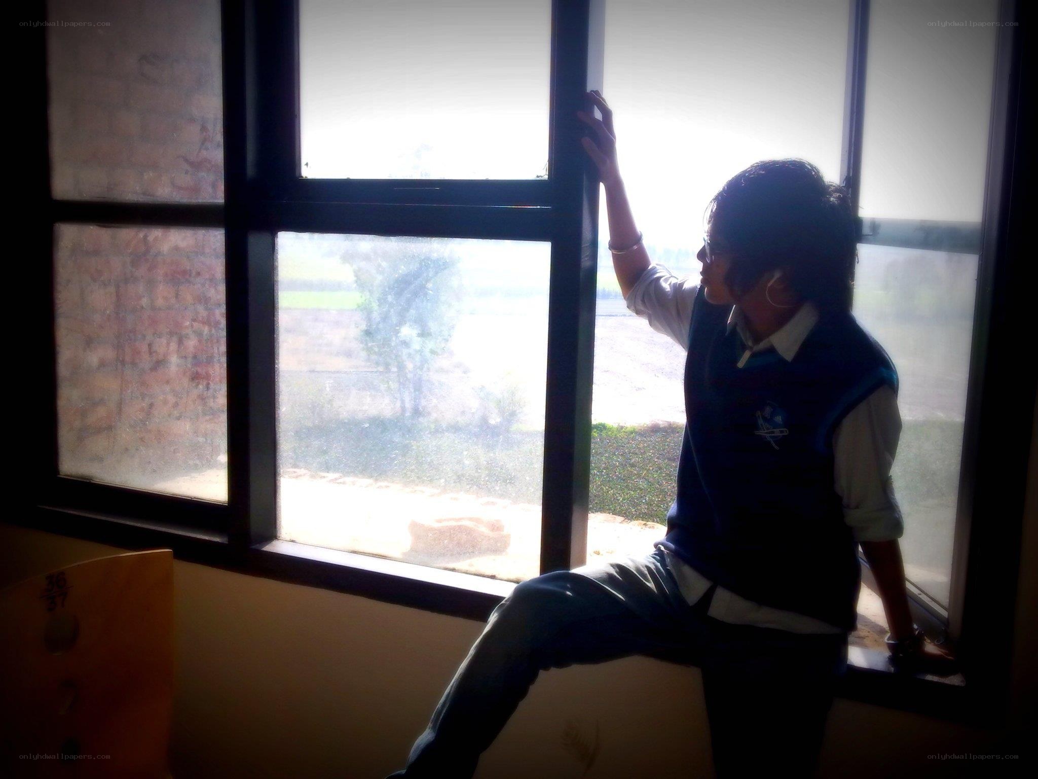 person sitting by a window