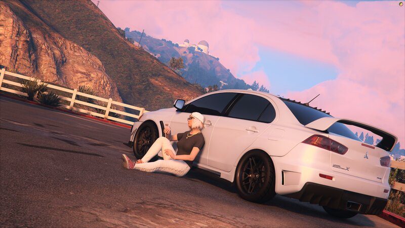 Person Sitting by Car — White