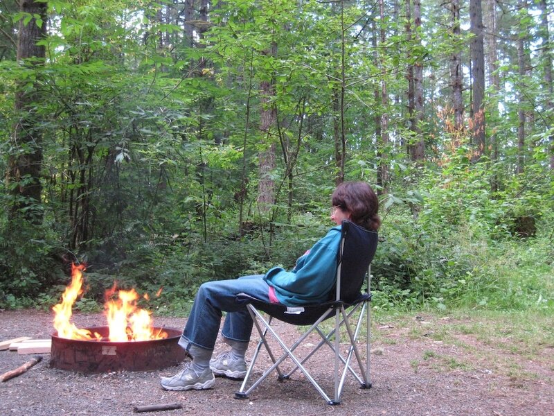 Person Sitting by Fire