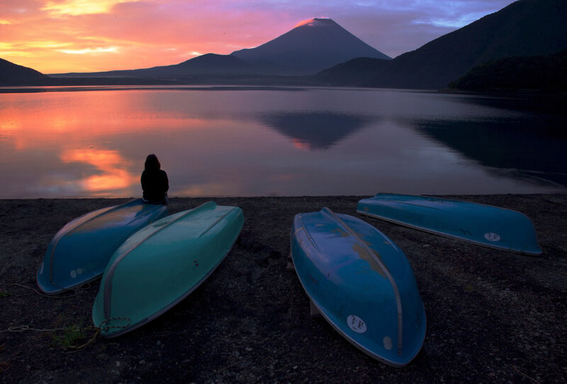 Person Sitting by Lake — Blue, Serene