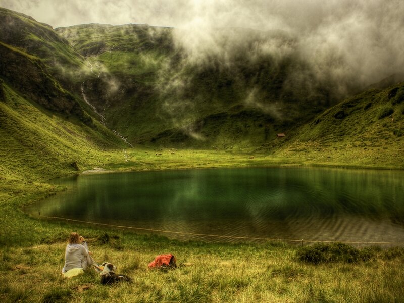 Person Sitting by Lake