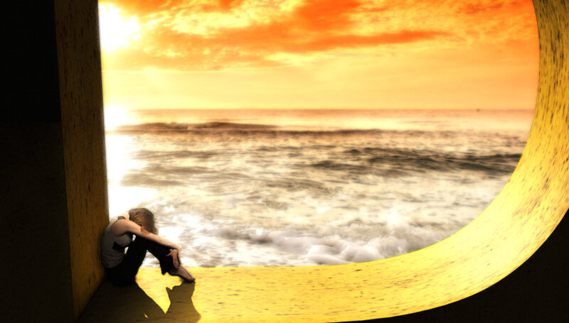 Person Sitting by Ocean