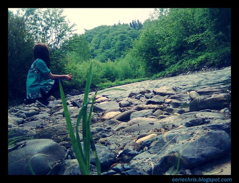 Person Sitting by River