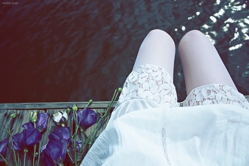Person Sitting by Water — White