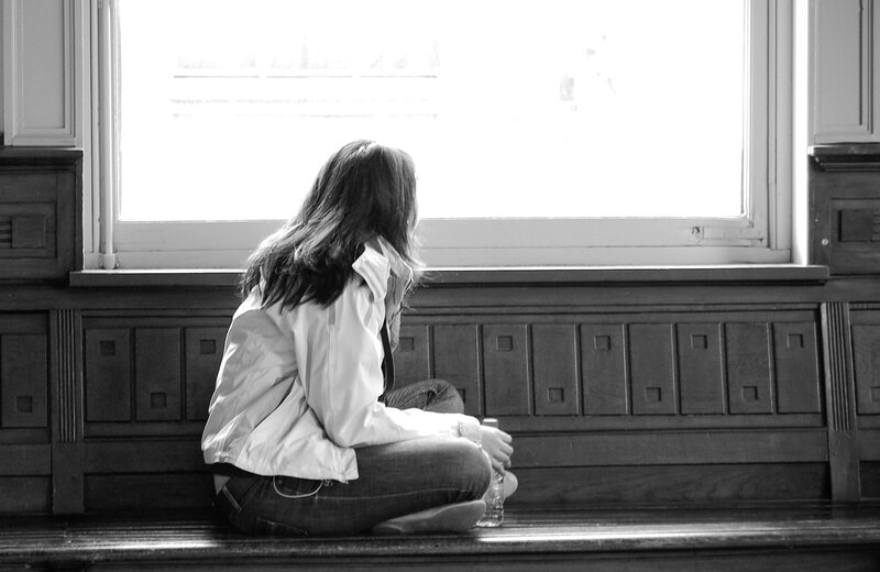 person sitting by window