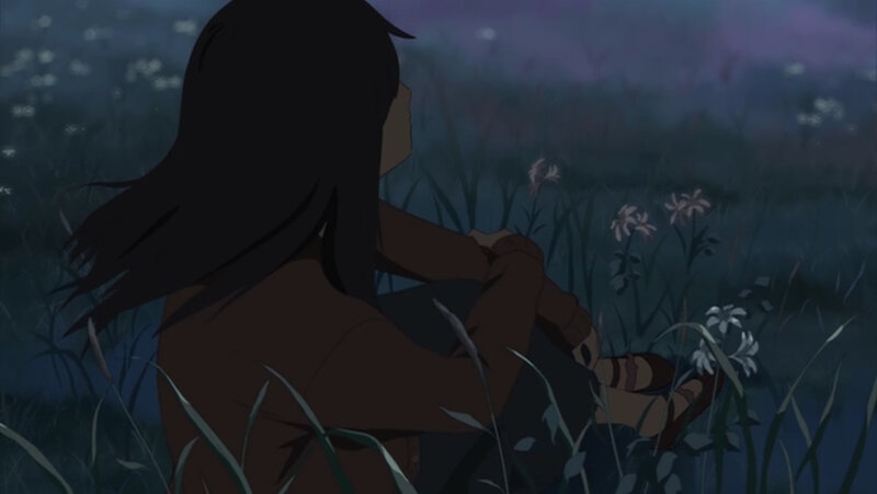 person sitting in a field