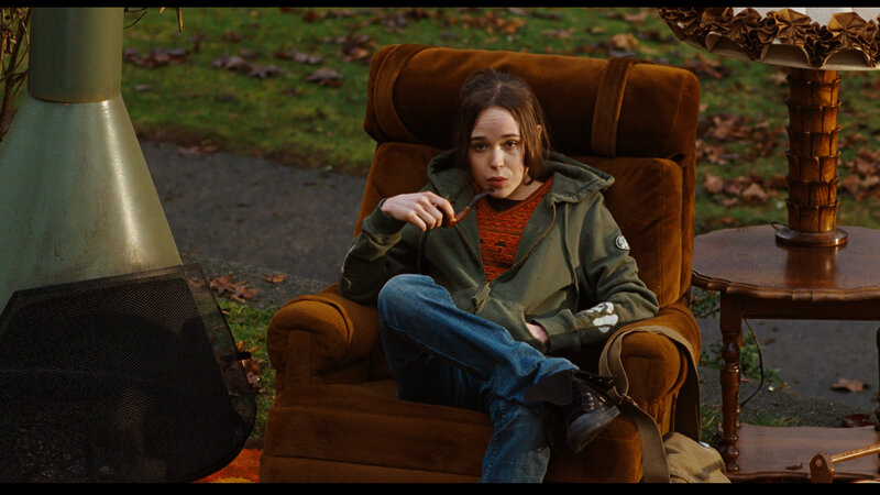 person sitting in armchair outdoors
