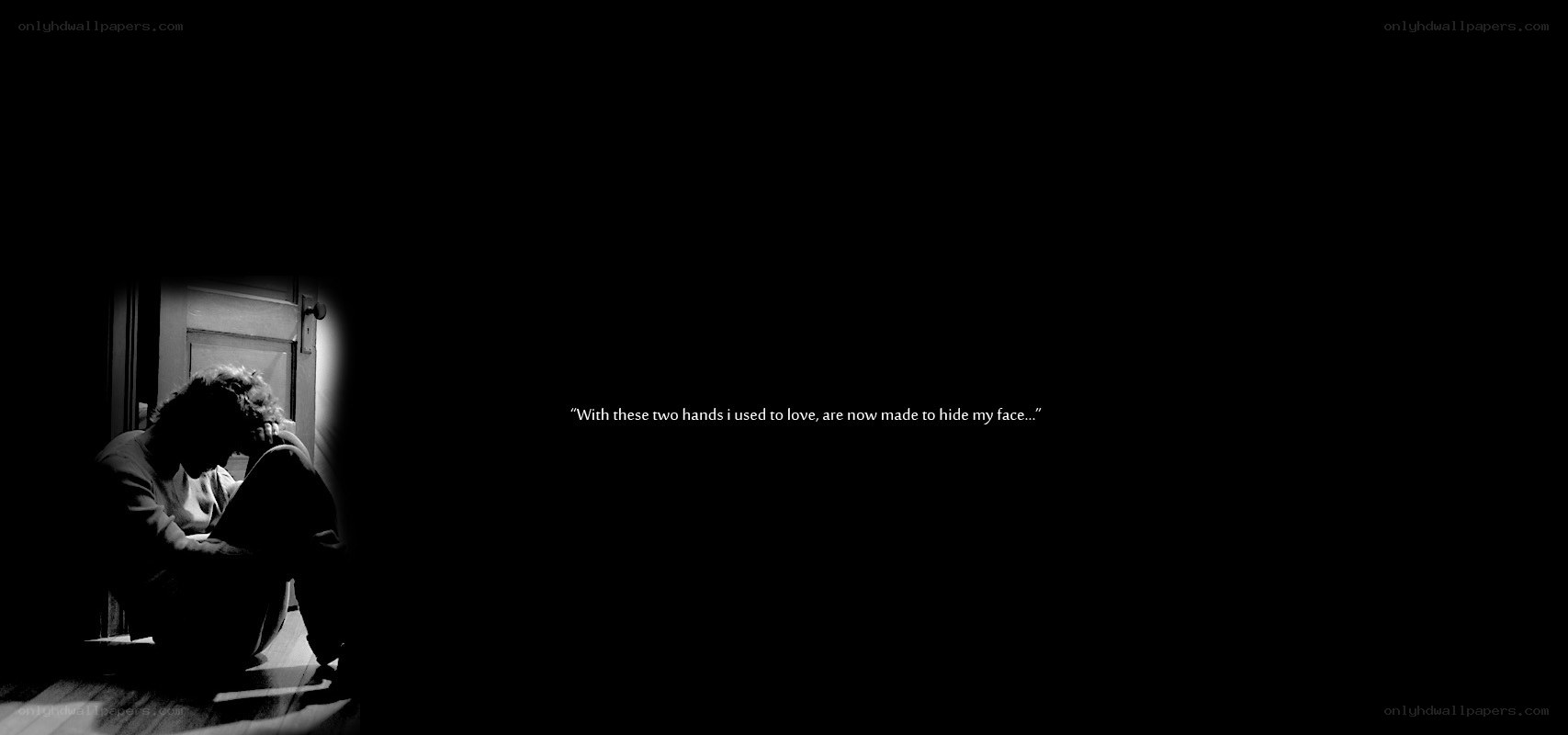 person sitting in darkness