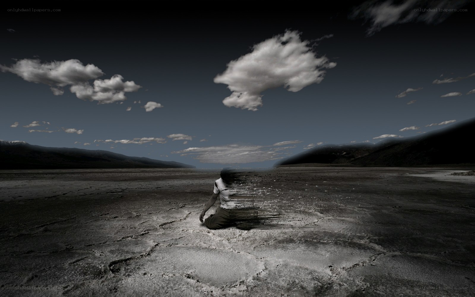 person sitting in desert landscape