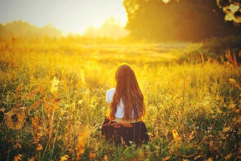 Person Sitting in Field