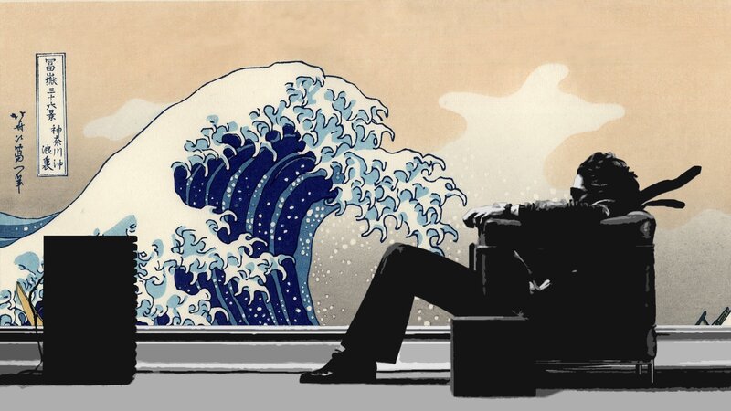 person sitting in front of wave artwork