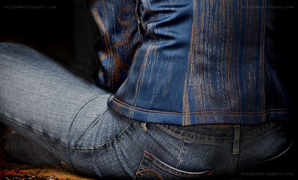 person sitting in jeans