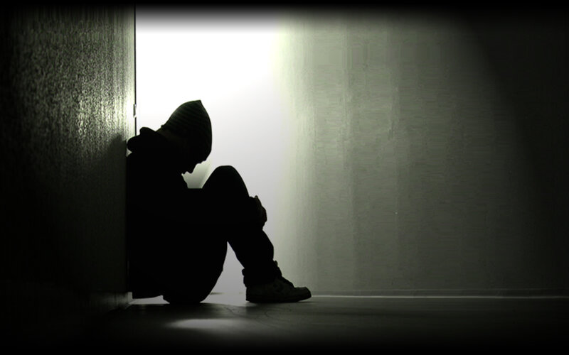 person sitting in silhouette