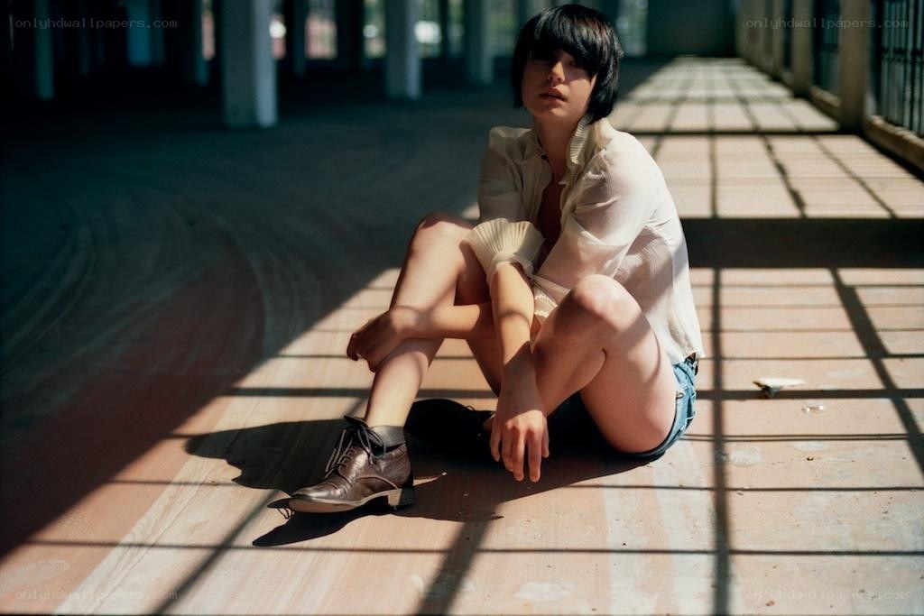person sitting in sunlight