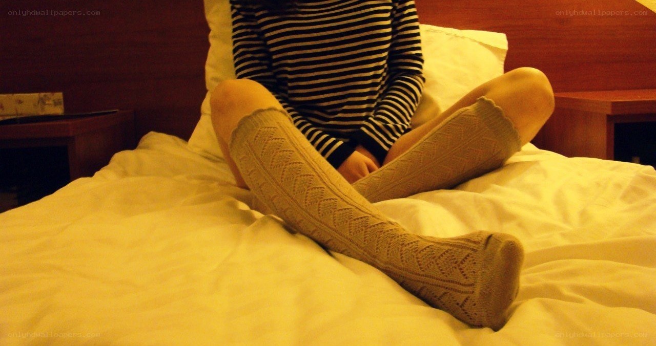 person sitting on a bed