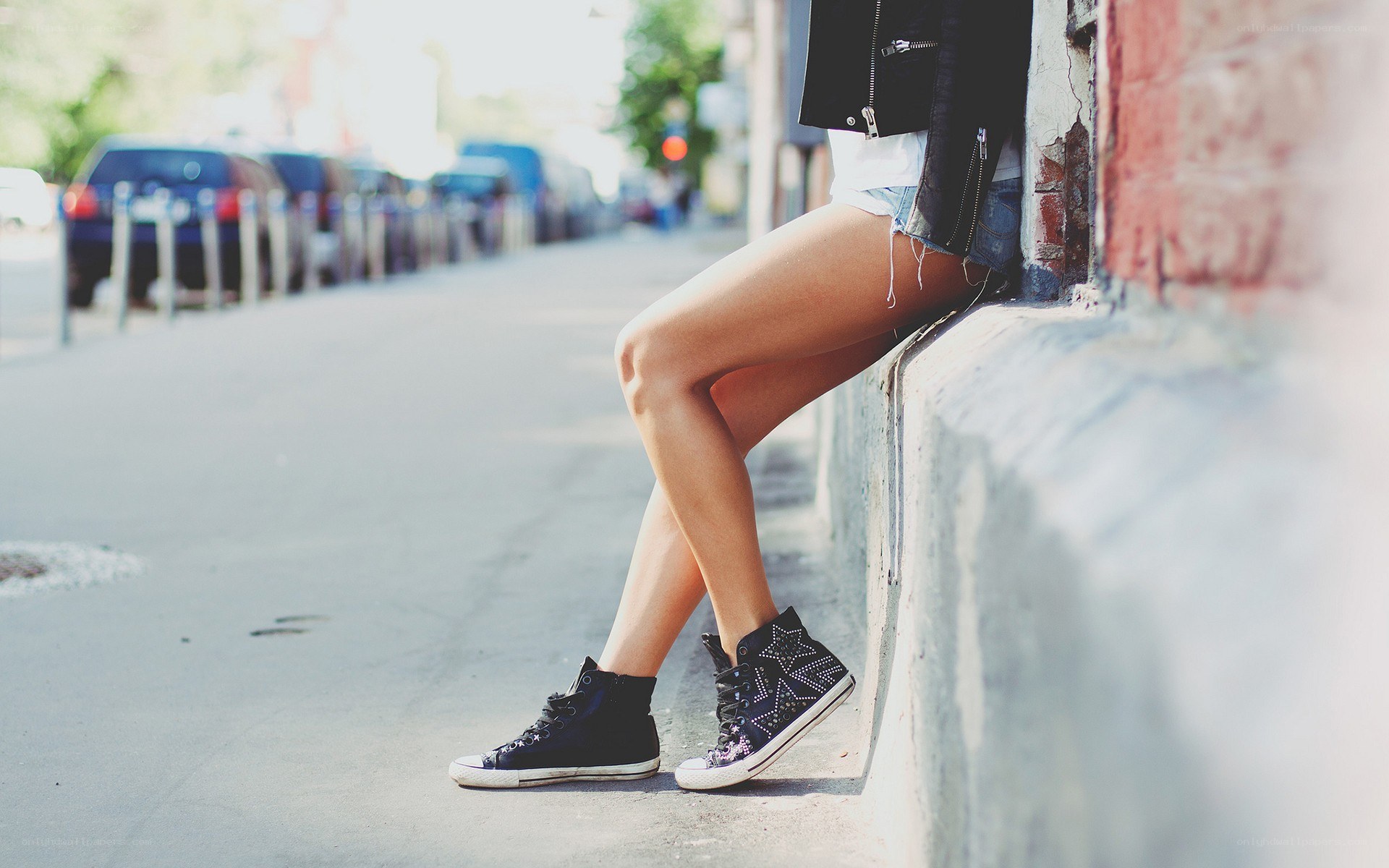 person sitting on a curb