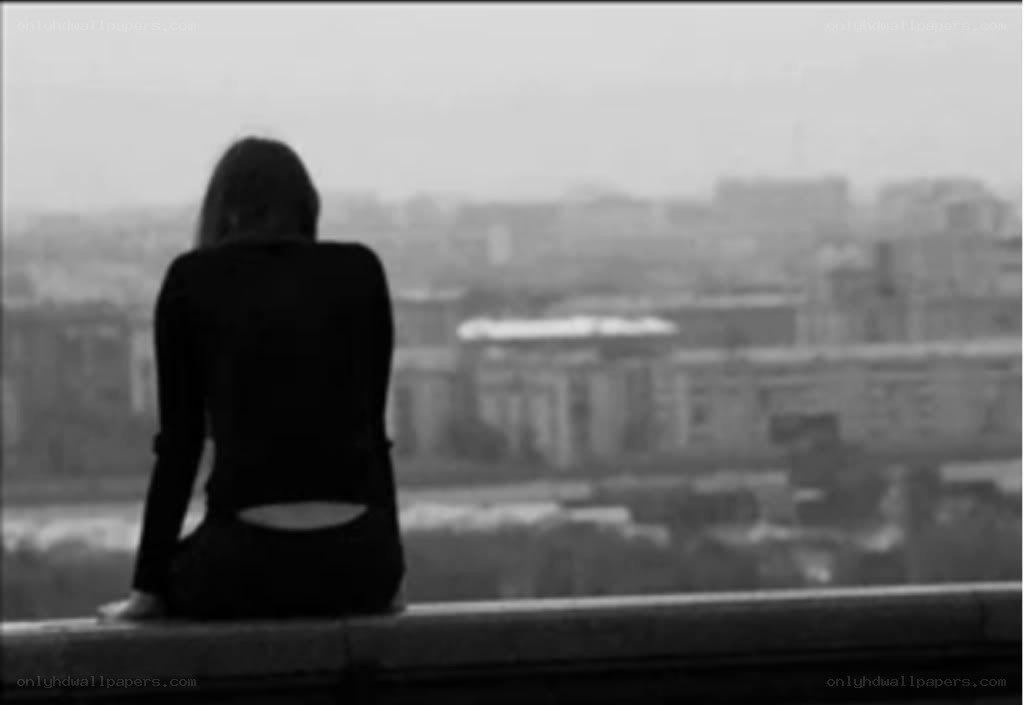 person sitting on a ledge
