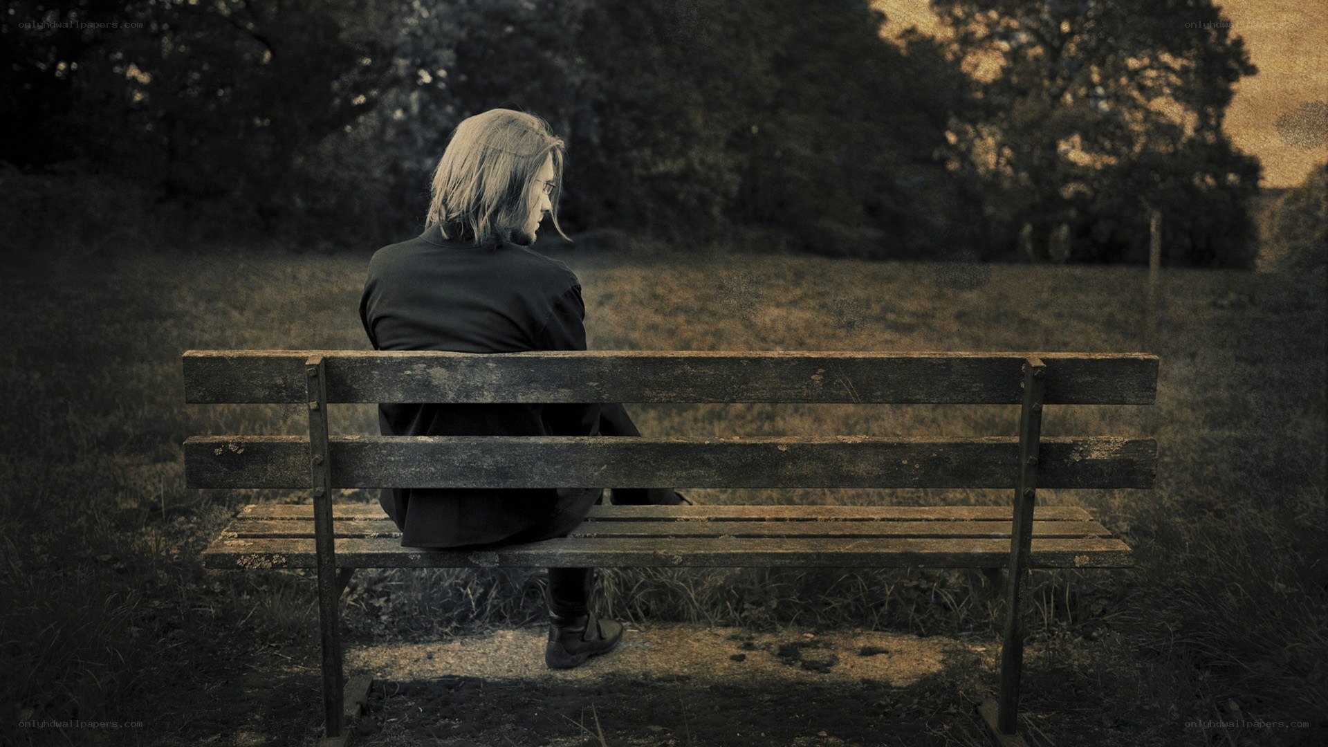 person sitting on a park bench